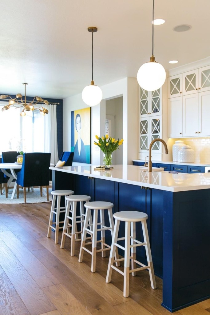blue and white kitchen with kitchen island stools and