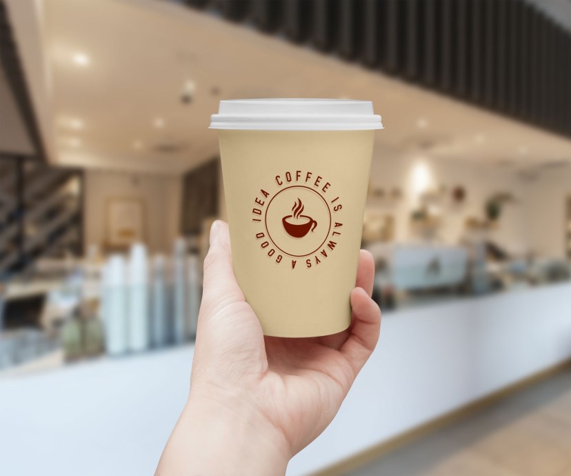 free hand holding coffee cup mockup psd designbolts