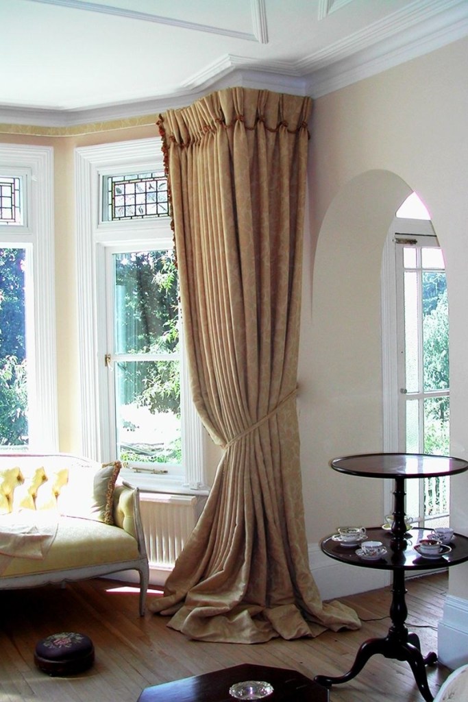 buy curtains with a slightly longer length and let them pool