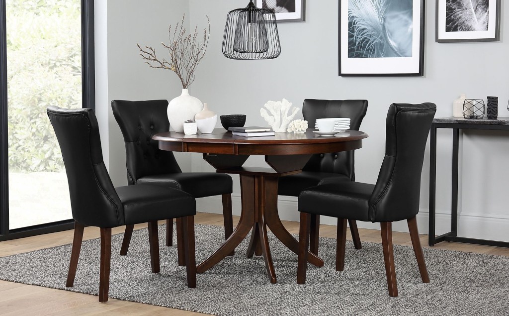 hudson round dark wood extending dining table with 6 bewley brown leather chairs