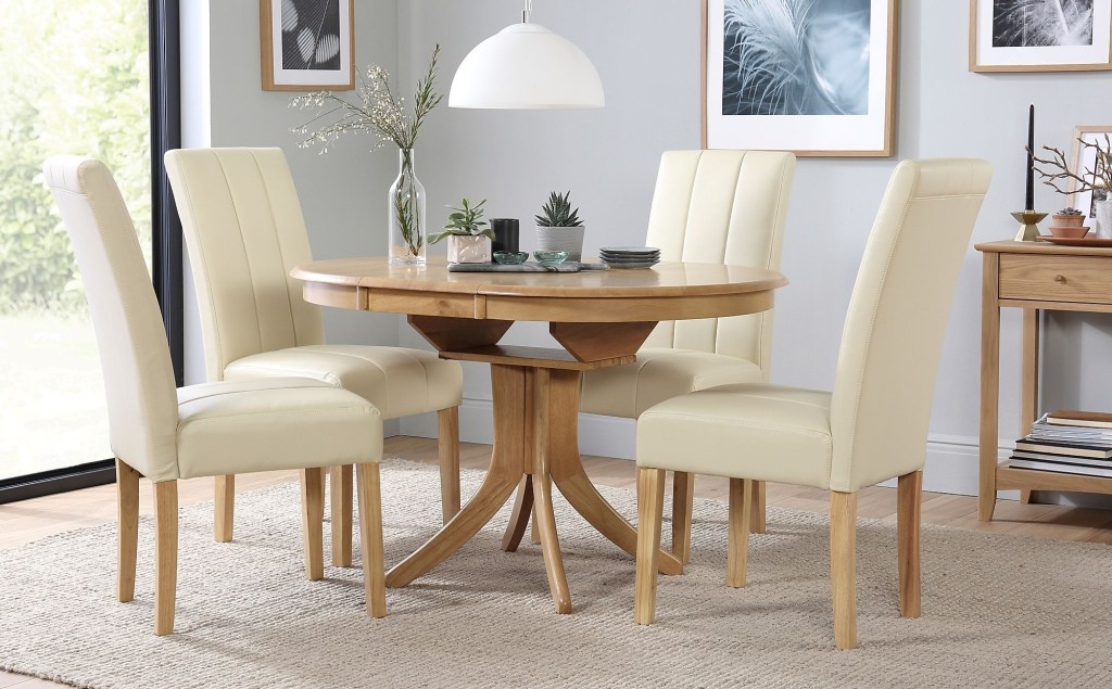 hudson round oak extending dining table with 6 carrick ivory leather chairs