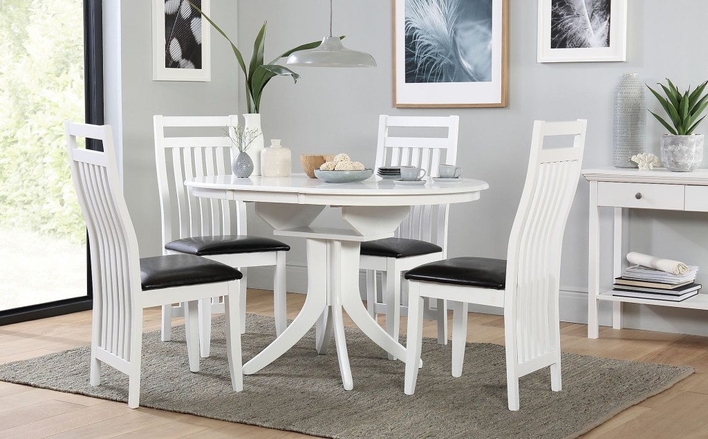 hudson round white extending dining table with 6 java chairs black leather seat pads
