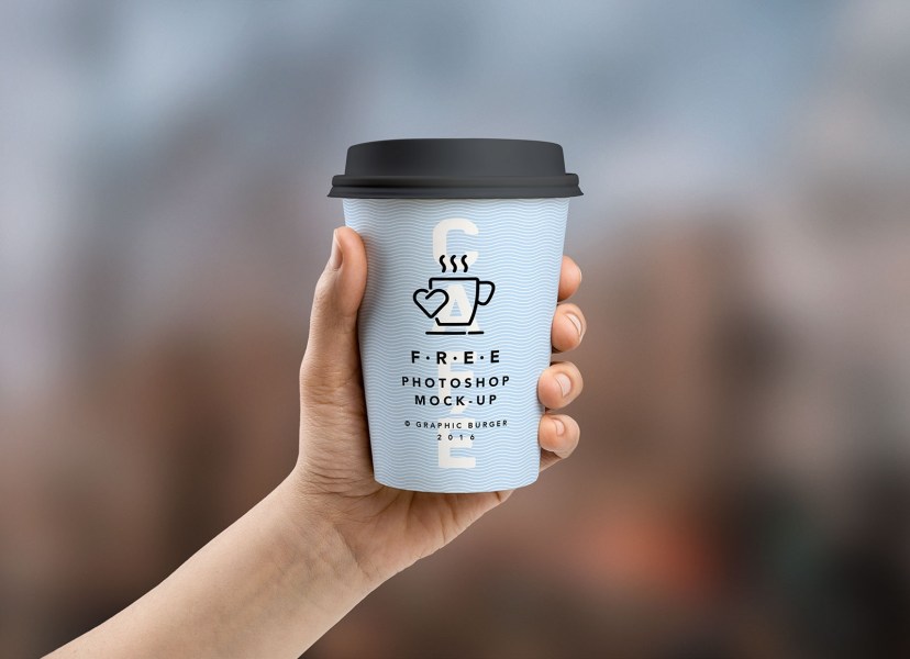 free coffee paper cup in hand mockup psd good mockups