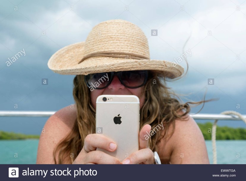 woman holding iphone 6 high resolution stock photography and